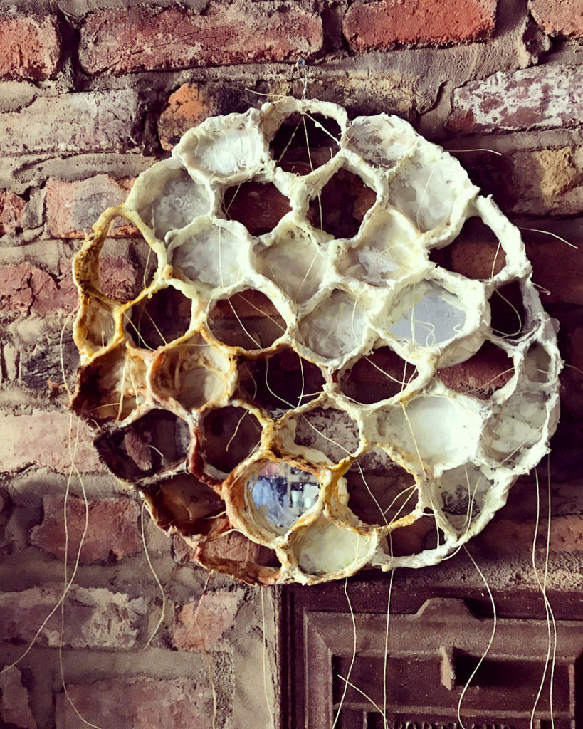 Circular honeycomb sculpture by Bridgette Guerzon Mills