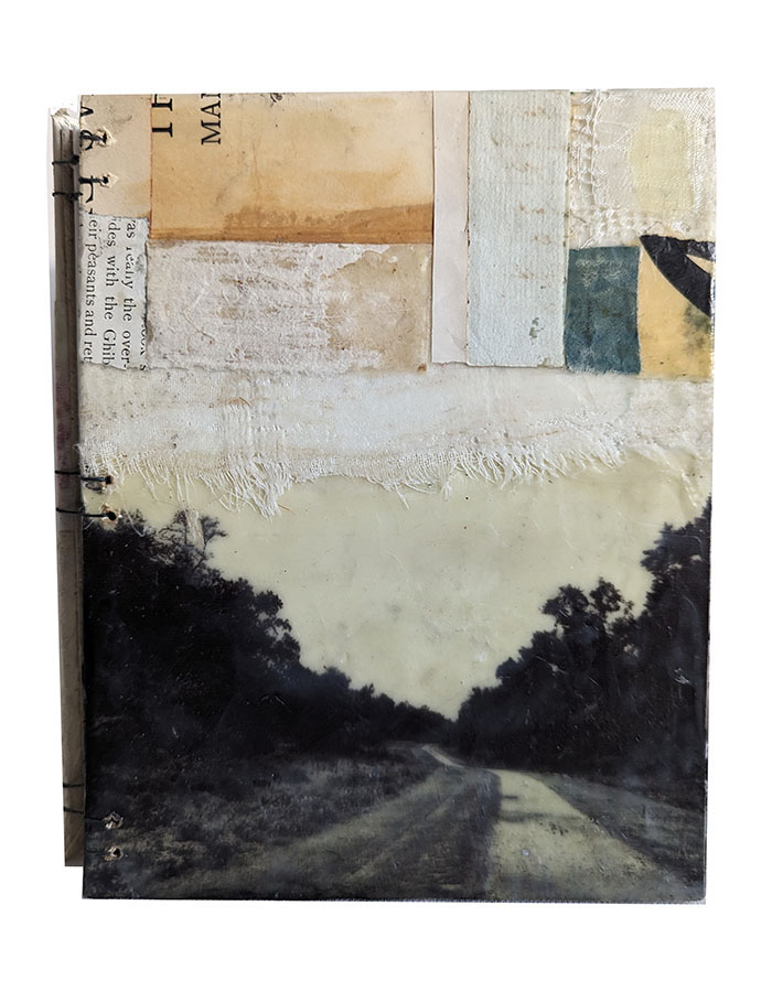 The Path Is Made By Walking is an original handbound blank journal by Bridgette Guerzon Mills that features a pathway into trees.